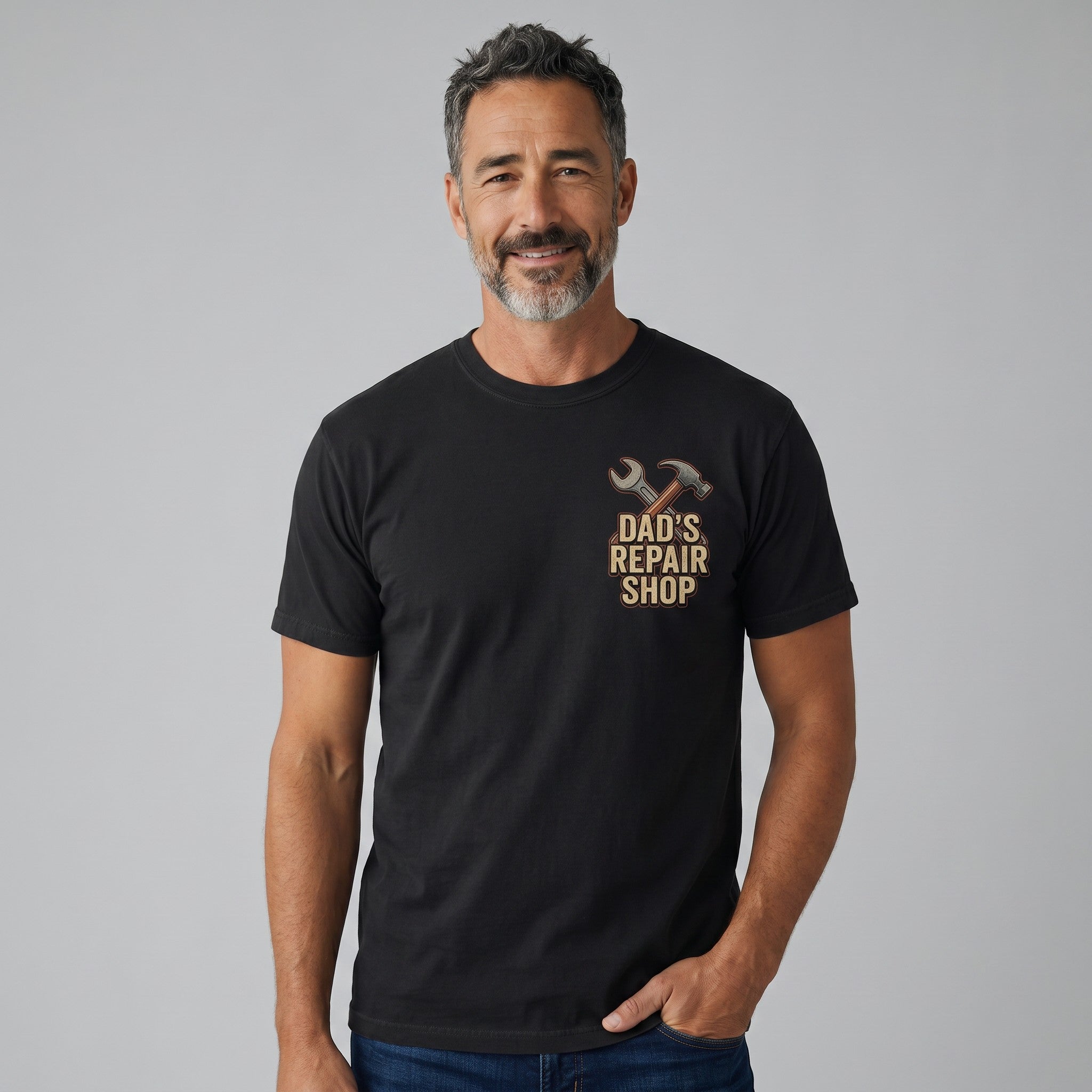 TrendyShift.Com black crew neck t-shirt featuring a Dad's Repair Shop graphic on a smiling man